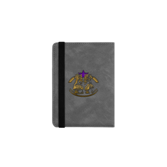 A gray passport cover with a purple and gold logo on the front.